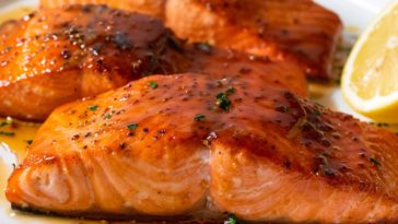 Flaky salmon fillet coated in a glossy honey glaze, golden and caramelized.