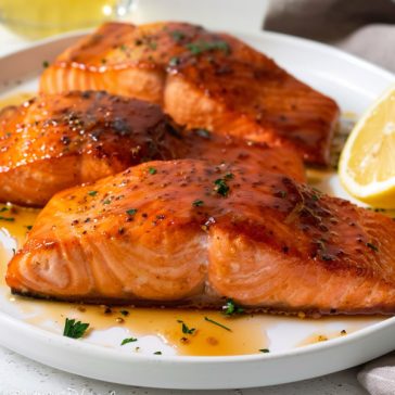 Flaky salmon fillet coated in a glossy honey glaze, golden and caramelized.