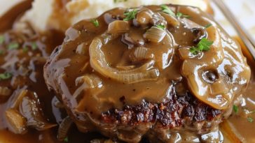 Juicy hamburger steak topped with caramelized onions and rich brown gravy.