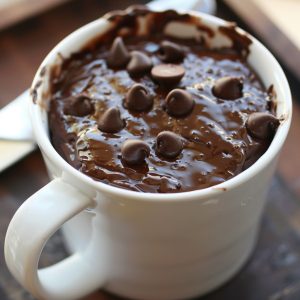 Warm chocolate mug cake cooked in the microwave, soft and rich texture.