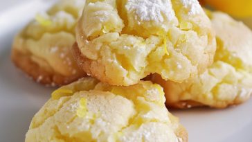 Soft lemon cloud cookies dusted with powdered sugar and bursting with citrus flavor.