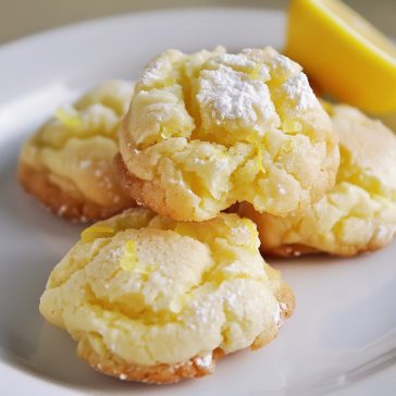 Soft lemon cloud cookies dusted with powdered sugar and bursting with citrus flavor.
