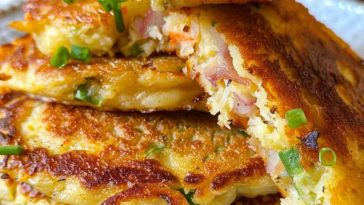 Crispy stuffed potato pancakes with a golden crust and cheesy savory filling, served warm with a creamy dip.