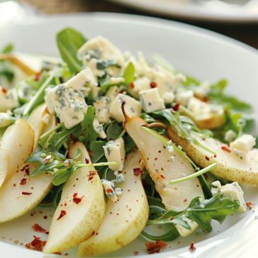 Roquefort pear salad with fresh greens, nuts, and creamy blue cheese.