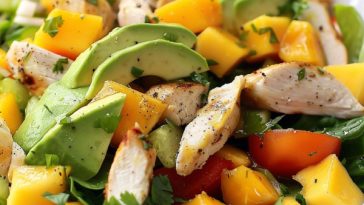 Fresh chicken mango avocado salad with grilled chicken, juicy mango chunks, creamy avocado, mixed greens, and a light dressing.