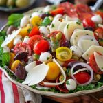 Antipasto salad – Colorful salad with cured meats, cheese, olives, and fresh vegetables.