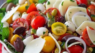 Antipasto salad – Colorful salad with cured meats, cheese, olives, and fresh vegetables.
