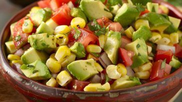 Avocado corn salad with fresh herbs and a zesty dressing.