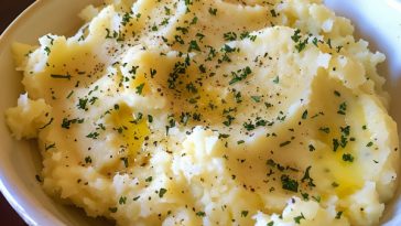 Creamy mashed potatoes with butter, smooth and fluffy texture.