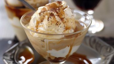 Affogato dessert with a scoop of vanilla ice cream topped with hot espresso, creating a creamy coffee treat.