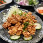Crispy Japanese chicken karaage pieces fried to golden perfection and served with lemon wedges.