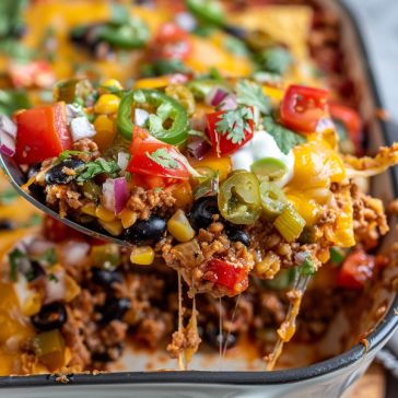 Cheesy taco casserole with layers of seasoned beef, tortillas, and melted cheese.