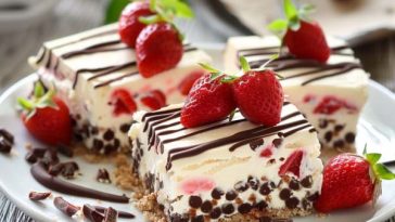Assorted no-bake treats including chocolate bites, fruit bars, and nut clusters arranged on a dessert platter.