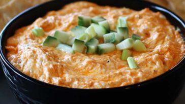 Make this Super Bowl Buffalo Chicken Dip—spicy, cheesy, and perfect for tailgates and party spreads!