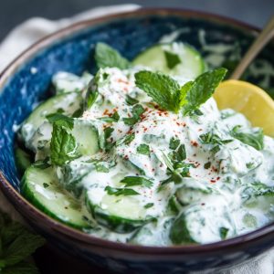 Creamy cucumber salad with lemon yogurt dressing served in a bowl