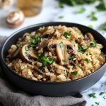 One pot mushroom rice with garlic ranch seasoning served in a rustic skillet.