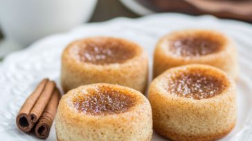 Four round pastries with cinnamon
