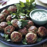 Grilled lamb koftas served with creamy yoghurt dressing and herbs