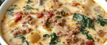 Bowl of creamy Zuppa Toscana soup with sausage, potatoes, and kale