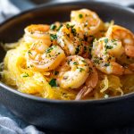 Shrimp scampi served over roasted spaghetti squash with garlic ranch butter sauce.