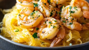Shrimp scampi served over roasted spaghetti squash with garlic ranch butter sauce.