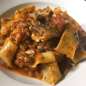 Calabrian Fish Ragu Pasta Recipe with tender fish, rich tomato sauce, and fresh herbs tossed with spaghetti, served in a bowl.