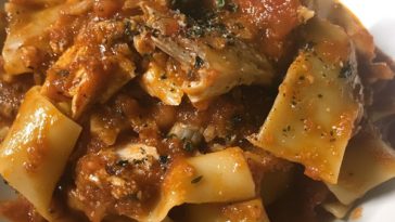 Calabrian Fish Ragu Pasta Recipe with tender fish, rich tomato sauce, and fresh herbs tossed with spaghetti, served in a bowl.