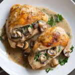 Juicy mushroom-stuffed chicken breast filled with sautéed mushrooms, garlic, and cheese, baked until golden and tender.