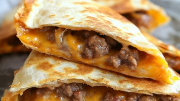 Crispy Oven Baked Quesadillas Recipe with golden-brown tortilla, melted cheese, and savory fillings served on a plate.