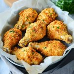 Crunchy Crumbed Chicken Drumsticks Recipe with golden-brown crispy coating served on a plate with dipping sauce.