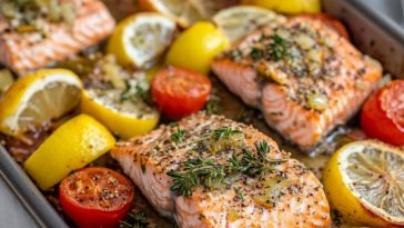 Lemon Garlic Salmon Tray Bake Recipe with perfectly baked salmon fillets, roasted vegetables, and fresh lemon slices on a tray.