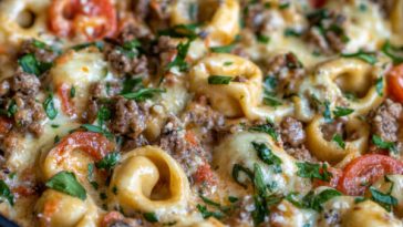 “Cheesesteak tortellini tossed in a creamy provolone sauce with tender beef strips and peppers, served in a skillet.”