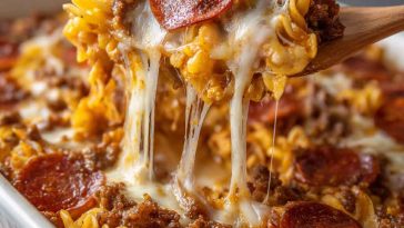 “A cheesy meat lovers pizza casserole baked with layers of pasta, marinara sauce, pepperoni, sausage, and melted mozzarella.”