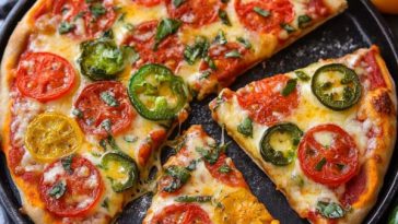 "Homemade margarita pizza with golden crust, fresh mozzarella, basil leaves, and vibrant tomato sauce."