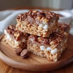 Chocolate-coated Rice Krispies tossed in powdered sugar and peanut butter, served in a festive bowl with a crunchy texture.