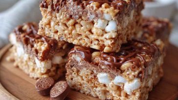 Chocolate-coated Rice Krispies tossed in powdered sugar and peanut butter, served in a festive bowl with a crunchy texture.