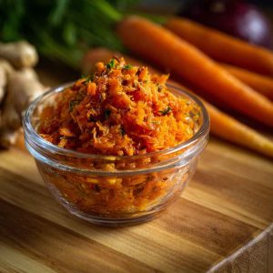 Golden smashed carrots roasted until crispy, garnished with fresh herbs and a drizzle of tahini or yogurt sauce.