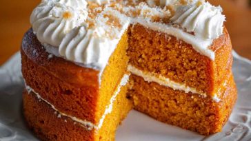 Moist pumpkin cake drizzled with honey garlic glaze, topped with shrimp for a unique sweet-savory twist.