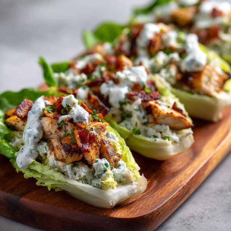 Chicken bacon ranch lettuce boats filled with juicy chicken, crispy bacon, shredded cheese, and creamy ranch dressing.
