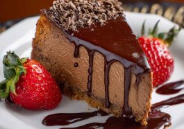 Chocolate San Sebastian cheesecake with a burnt top and creamy, dark chocolate interior on a rustic plate.