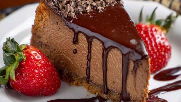 Chocolate San Sebastian cheesecake with a burnt top and creamy, dark chocolate interior on a rustic plate.