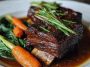 Slow-roasted Asian beef short ribs glazed with a caramelized soy-ginger sauce, garnished with scallions and sesame seeds.