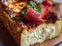 A golden, caramelized Basque cheesecake baked in a loaf pan, sliced to reveal its creamy center and rustic edges.