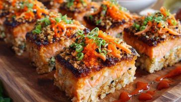 Easy spicy salmon sushi bake layered with rice, creamy spicy salmon, and drizzled with sriracha mayo.
