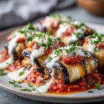 Rolled slices of roasted eggplant stuffed with ricotta and herbs, topped with marinara and melted mozzarella.
