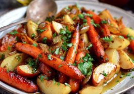 Autumn Bliss maple dijon roasted apples and carrots on a rustic baking tray, caramelized and garnished with fresh herbs.