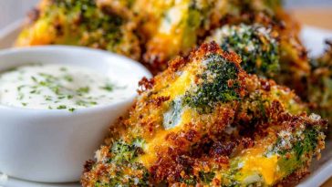"A plate of crispy broccoli cheddar poppers served with a dipping sauce, perfect for a healthy snack."