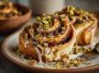 Freshly baked pistachio cinnamon buns swirled with cinnamon sugar, topped with crushed pistachios and creamy glaze.