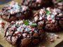Chocolate peppermint brownie cookies with fudgy centers, crushed peppermint candy topping, and a festive holiday presentation.