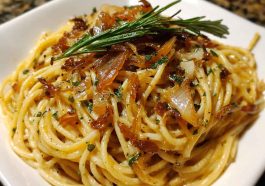 Caramelized onion and garlic spaghetti tossed with golden onions, roasted garlic, olive oil, and fresh herbs.